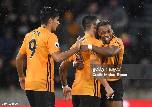 Adama Traore of Wolverhampton Wanderers celebrates with teammates after scoring his team's first goal during the Premier League match between...