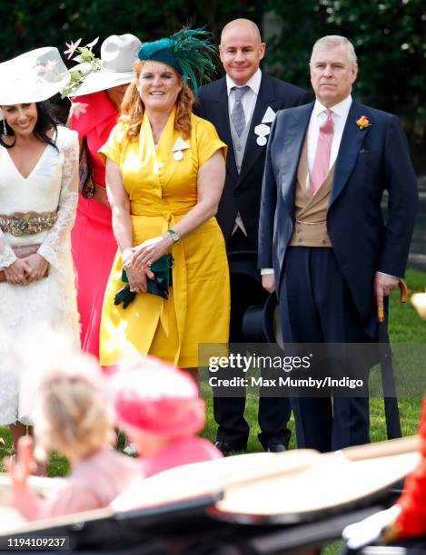 Sarah Ferguson, Duchess of York, Johan Eliasch and Prince Andrew, Duke of York look on as Queen Elizabeth II travels past in a horse drawn carriage...