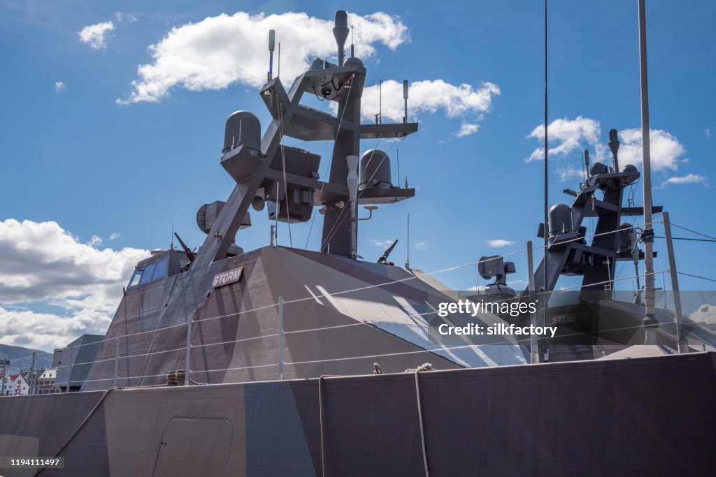 Skjold class corvettes of Royal Norwegian Navy in Bergen harbor on sunny day in spring
