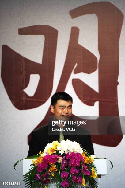 Chinese basketball player Yao Ming arrives at his press conference announcing his retirement from basketball on July 20, 2011 in Shanghai, China.