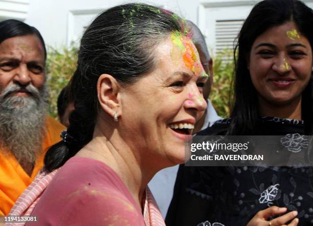 Chairperson of the Congress-led UPA government and Congress Party President Sonia Gandhi celebrates "Holi" with party supporters in New Delhi on...