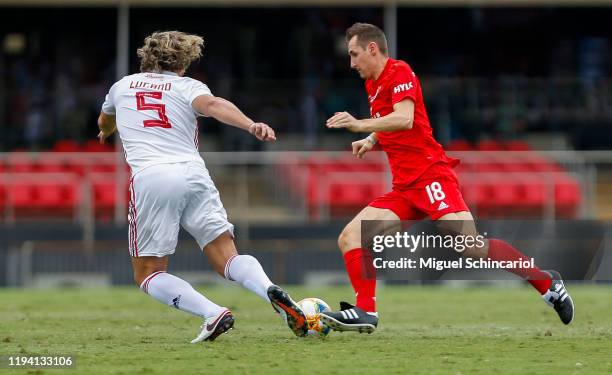 Diego Lugano of Sao Paulo FC vies for the ball with Miroslav Klose of FC Bayern Muenchen during a match between Sao Paulo FC and FC Bayern Muenchen...