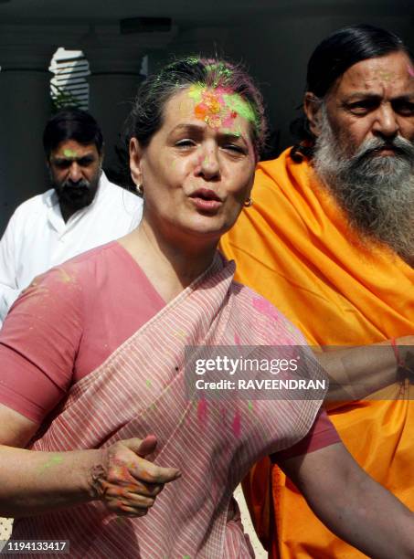 Chairperson of the Congress-led UPA government and Congress Party President Sonia Gandhi celebrates "Holi" with party supporters in New Delhi on...