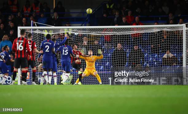 Dan Gosling of AFC Bournemouth scores his team's first goal over Kepa Arrizabalaga of Chelsea after it was reviewed by VAR during the Premier League...
