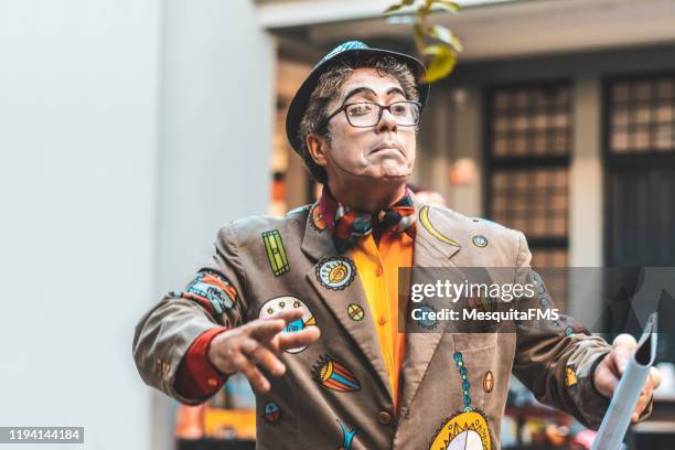 the street artist making a face - theater drama show stock pictures, royalty-free photos & images