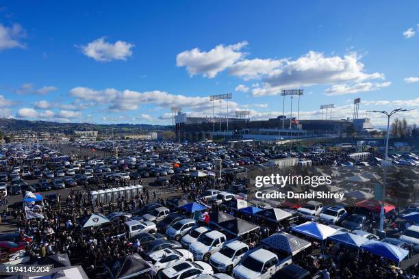 Oakland Raiders fans tailgate outside of RingCentral Coliseum prior to the game against the Jacksonville Jaguars on December 15, 2019 in Oakland,...