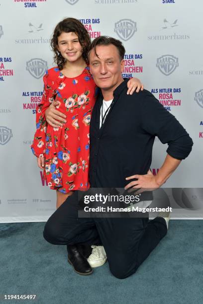 Riva Krymalowski and Oliver Masucci attend the premiere of "Als Hitler das rosa Kaninchen stahl" at Arri Kino on December 15, 2019 in Munich, Germany.