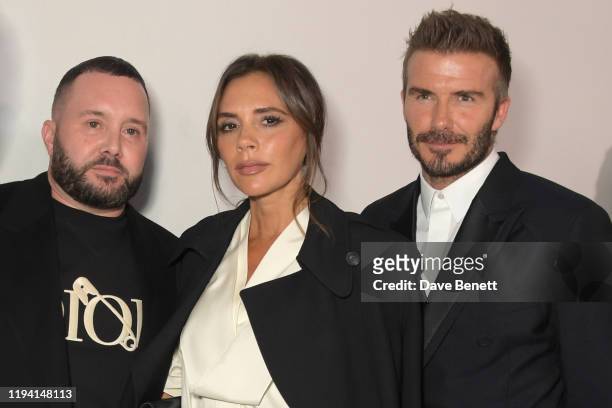 Kim Jones, Victoria Beckham and David Beckham attend the Dior Homme Menswear Fall/Winter 2020-2021 show as part of Paris Fashion Week on January 17,...