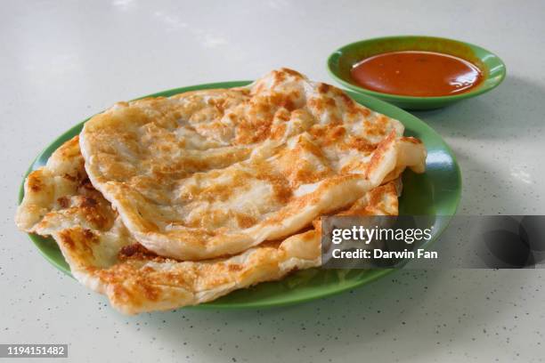 roti prata canai - singapore food stock pictures, royalty-free photos & images