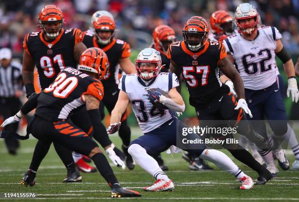 Rex Burkhead of the New England Patriots runs on his way to scoring a 33-yard rushing touchdown during the fourth quarter against the Cincinnati...