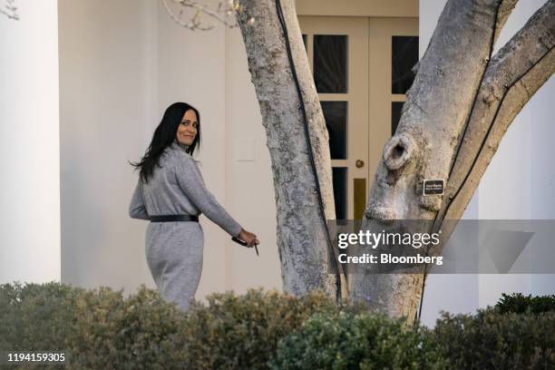 Stephanie Grisham, White House Press Secretary, watches as U.S. President Donald Trump, not pictured, walks to board Marine One on the South Lawn of...