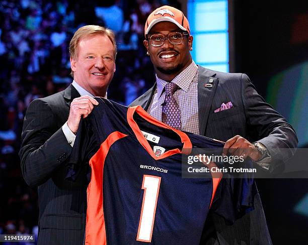 Von Miller, #2 overall pick by the Denver Broncos holds up a jersey on stage during the 2011 NFL Draft at Radio City Music Hall on April 28, 2011 in...