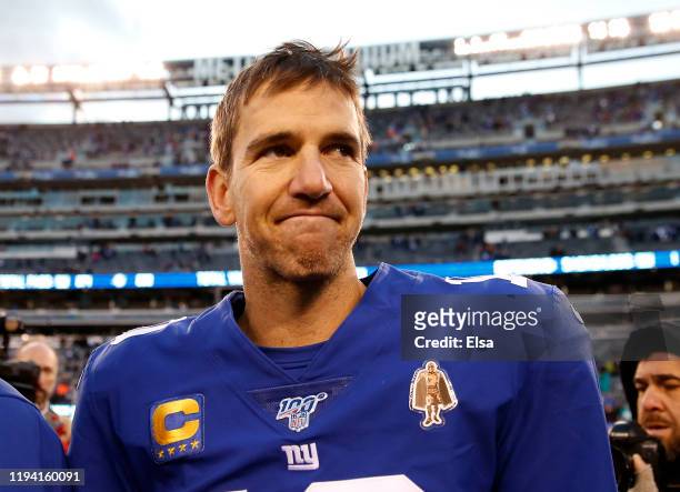 Eli Manning of the New York Giants walks on the field after the game against the Miami Dolphins at MetLife Stadium on December 15, 2019 in East...