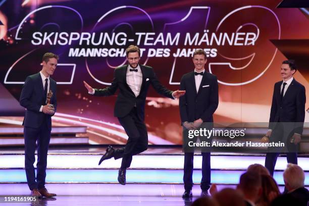 Markus Eisenbichler performes a traditional bavarian dance with team mates Stephan Leyhe , Karl Geiger and Richard Freitag of Team Skispringen as...