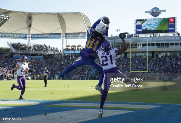 Mike Williams of the Los Angeles Chargers catches a pass for a touchdown over cornerback Mike Hughes of the Minnesota Vikings in the second quarter...