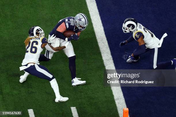 Jason Witten of the Dallas Cowboys runs into the end zone against Marqui Christian of the Los Angeles Rams and Jalen Ramsey of the Los Angeles Rams...