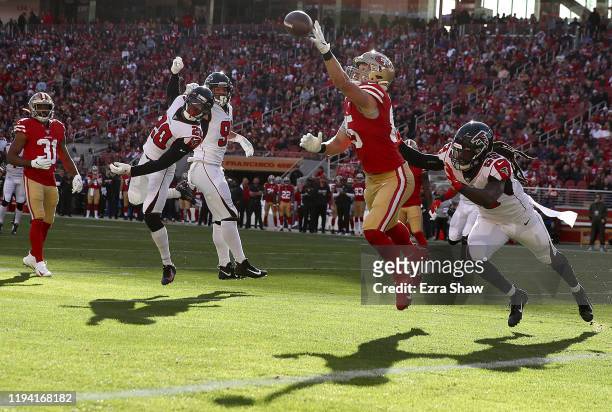 Tight end George Kittle of the San Francisco 49ers is unable to complete a pass against outside linebacker De'Vondre Campbell of the Atlanta Falcons...