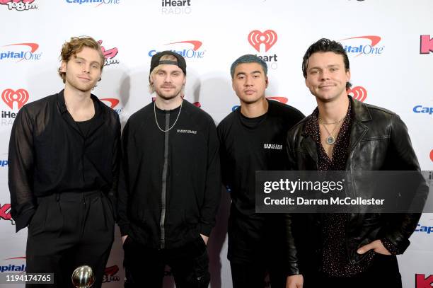 Luke Hemmings, Michael Clifford, Calum Hood, and Ashton Irwin of 5 Seconds of Summer attend KISS 108's iHeartRadio Jingle Ball 2019 on December 15,...