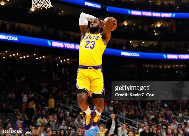 LeBron James of the Los Angeles Lakers dunks against the Atlanta Hawks in the first half at State Farm Arena on December 15, 2019 in Atlanta,...