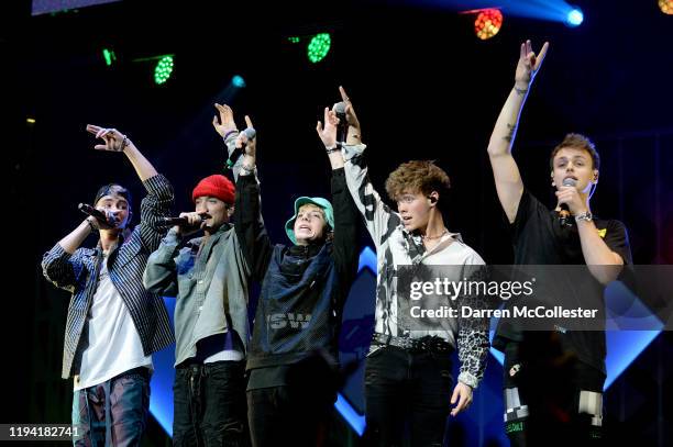 Corbyn Besson, Daniel Seavey, Jack Avery, Zach Herron, and Jonah Marais of Why Don't We perform onstage during KISS 108's iHeartRadio Jingle Ball...