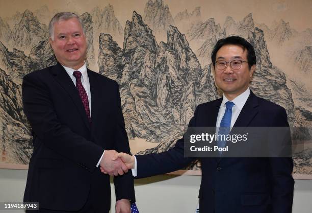 Special Representative for North Korea Stephen Biegun shakes hands with South Korea's special representative for Korean Peninsula Peace and Security...