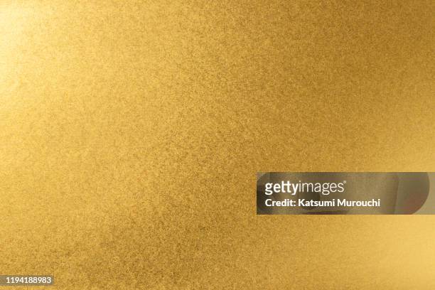 gold paper texture background - gold coloured stock pictures, royalty-free photos & images