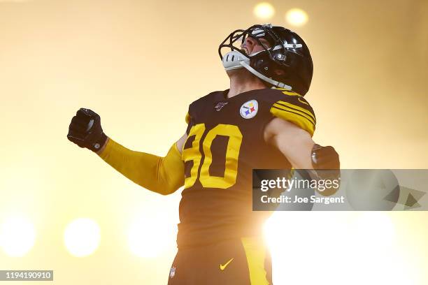 Watt of the Pittsburgh Steelers jumps in the air as he runs onto the field before the game against the Buffalo Bills at Heinz Field on December 15,...