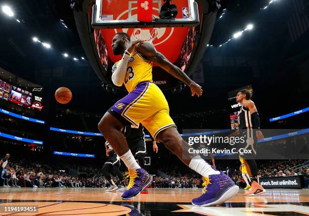 LeBron James of the Los Angeles Lakers reacts after a dunk against the Atlanta Hawks in the first half at State Farm Arena on December 15, 2019 in...