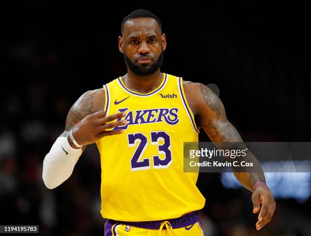 LeBron James of the Los Angeles Lakers reacts after hitting a three-point basket against the Atlanta Hawks in the second half at State Farm Arena on...