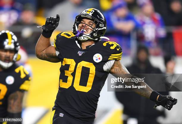 James Conner of the Pittsburgh Steelers celebrates scoring a touchdown during the third quarter against the Buffalo Bills in the game at Heinz Field...