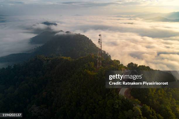 radio station on the top of the mountain at sunrise scene, thailand - antenne parabolique photos et images de collection