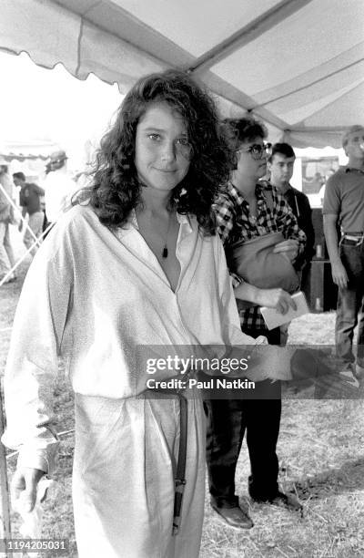 American actress Debra Winger poses backstage at the inagural Farm Aid benefit concert at Veteran's Stadium, Champaign, Illinois, September 22, 1985.