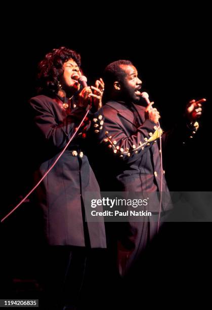 American Gospel singers BeBe and CeCe Winans perform onstage at the Aire Crown Theater, Chicago, Illinois, February 12, 1995.