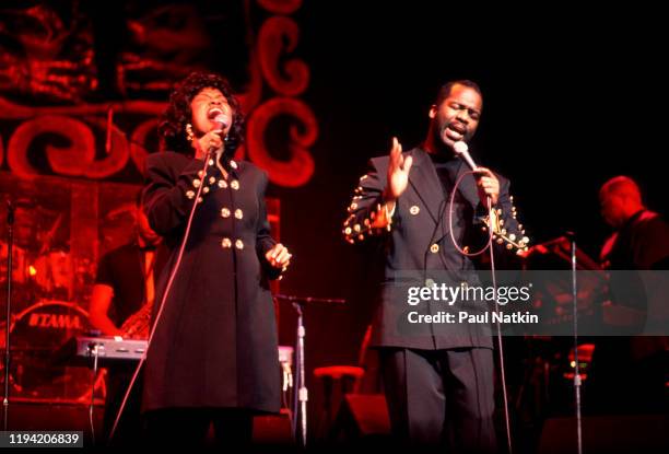 American Gospel singers BeBe and CeCe Winans perform onstage at the Aire Crown Theater, Chicago, Illinois, February 12, 1995.