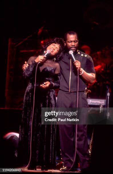 American Gospel singers BeBe and CeCe Winans perform onstage at the Aire Crown Theater, Chicago, Illinois, February 12, 1995.