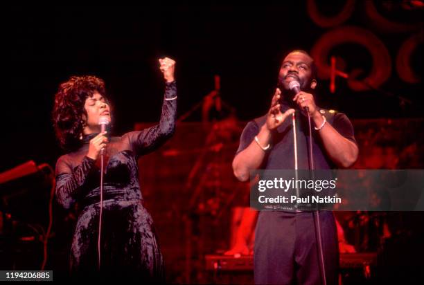 American Gospel singers BeBe and CeCe Winans perform onstage at the Aire Crown Theater, Chicago, Illinois, February 12, 1995.