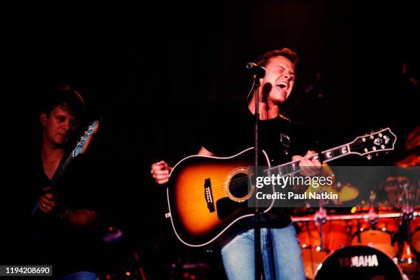 American Country musician Bryan White plays guitar as he performs onstage at Country Thunder, Twin Lakes, Wisconsin, July 15, 1998.