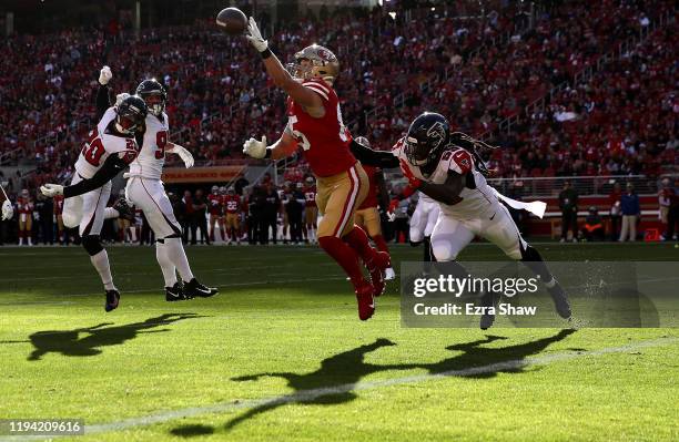 Tight end George Kittle of the San Francisco 49ers is unable to catch a pass against outside linebacker De'Vondre Campbell of the Atlanta Falcons...