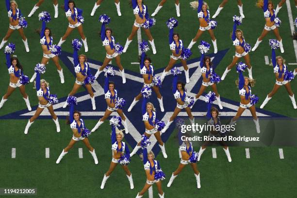 The Dallas Cowboys Cheerleaders perform before the game against the Los Angeles Rams at AT&T Stadium on December 15, 2019 in Arlington, Texas.