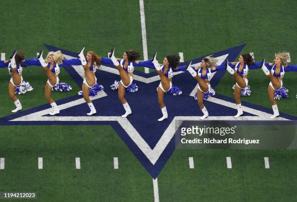 The Dallas Cowboys Cheerleaders perform before the game against the Los Angeles Rams at AT&T Stadium on December 15, 2019 in Arlington, Texas.