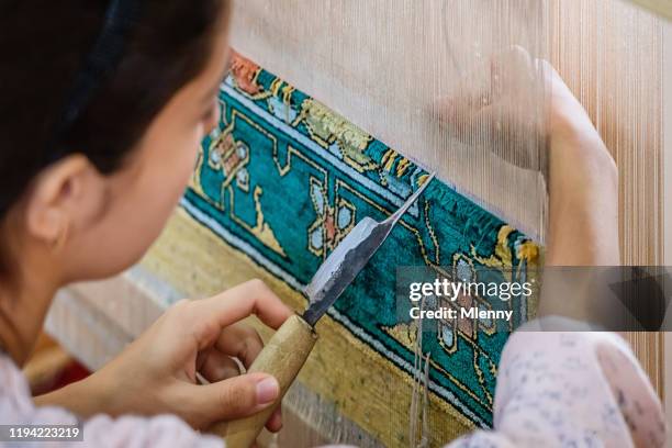 silk carpet knotting uzbekistan bukhara - uzbekistan market stock pictures, royalty-free photos & images