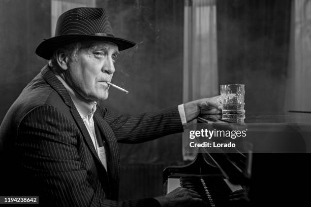 senior piano playing man - 1920s bar stock pictures, royalty-free photos & images