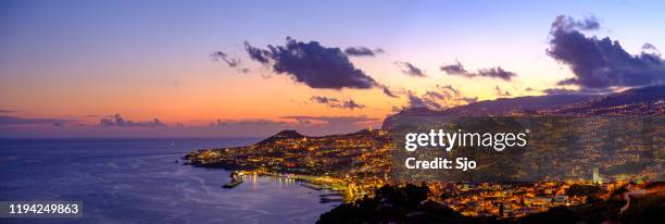 evening view over funchal, capitol of madeira island portugal during a summer night - funchal stock pictures, royalty-free photos & images