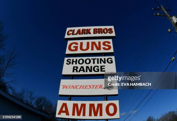 Billboards advertise Clark Brothers gun store and shooting range in Warrenton, Virginia, some 48 miles from Washington, DC on January 16, 2020. When...