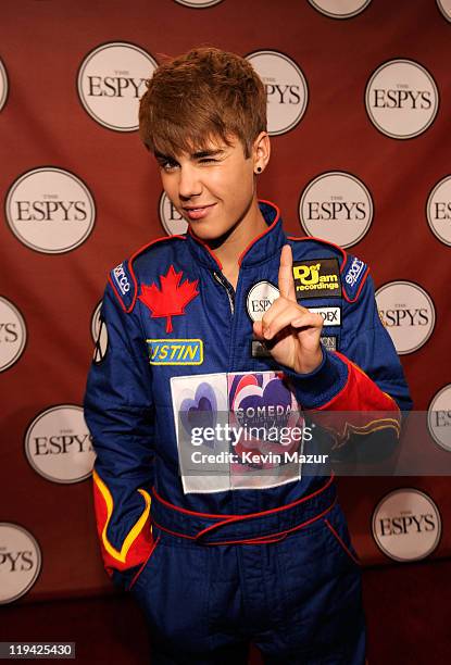 Singer Justin Bieber poses backstage after presenting the award for 'Best Team' at The 2011 ESPY Awards held at the Nokia Theatre L.A. Live on July...