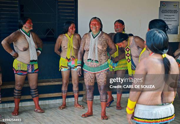 Indigenous activist Tuira , and fellow female members of the Kayapo tribe, wait to perform a ceremonial after a speech by their indigenous leader...