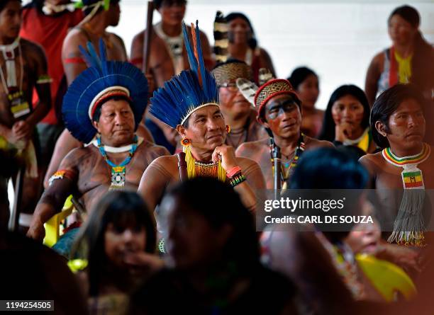 Members of the Kisejde tribe listen to their leader Cacique Raoni Metuktire of the Kayapo tribe, in Piaracu village, near Sao Jose do Xingu, Mato...