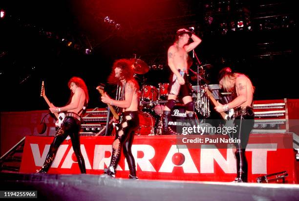 Members of American Rock group Warrant perform onstage at the Rosemont Horizon, Rosemont, Illinois, November 5, 1989. Pictured are, from left, Erik...