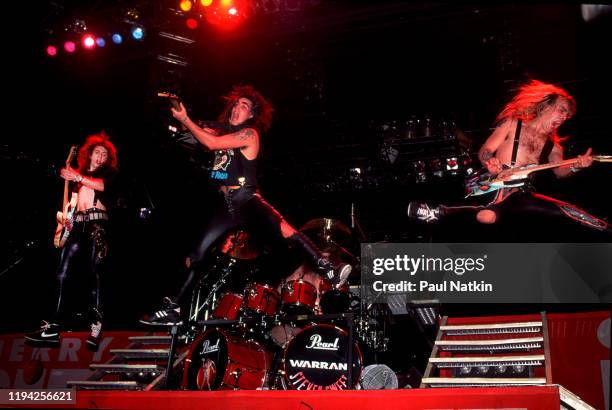 Members of American Rock group Warrant perform onstage at the Rosemont Horizon, Rosemont, Illinois, November 5, 1989. Pictured are, from left, Erik...