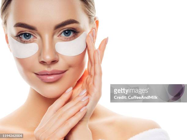 woman with eye patches under her eyes - antioxidants skin stock pictures, royalty-free photos & images